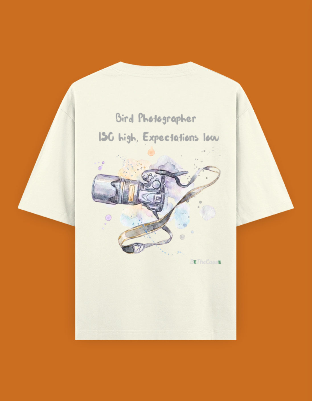 Shop a playful unisex oversized bird photographer t-shirt inspired by birding trips in the Western Ghats. Perfect for birders, wildlife photographers, and nature lovers.
