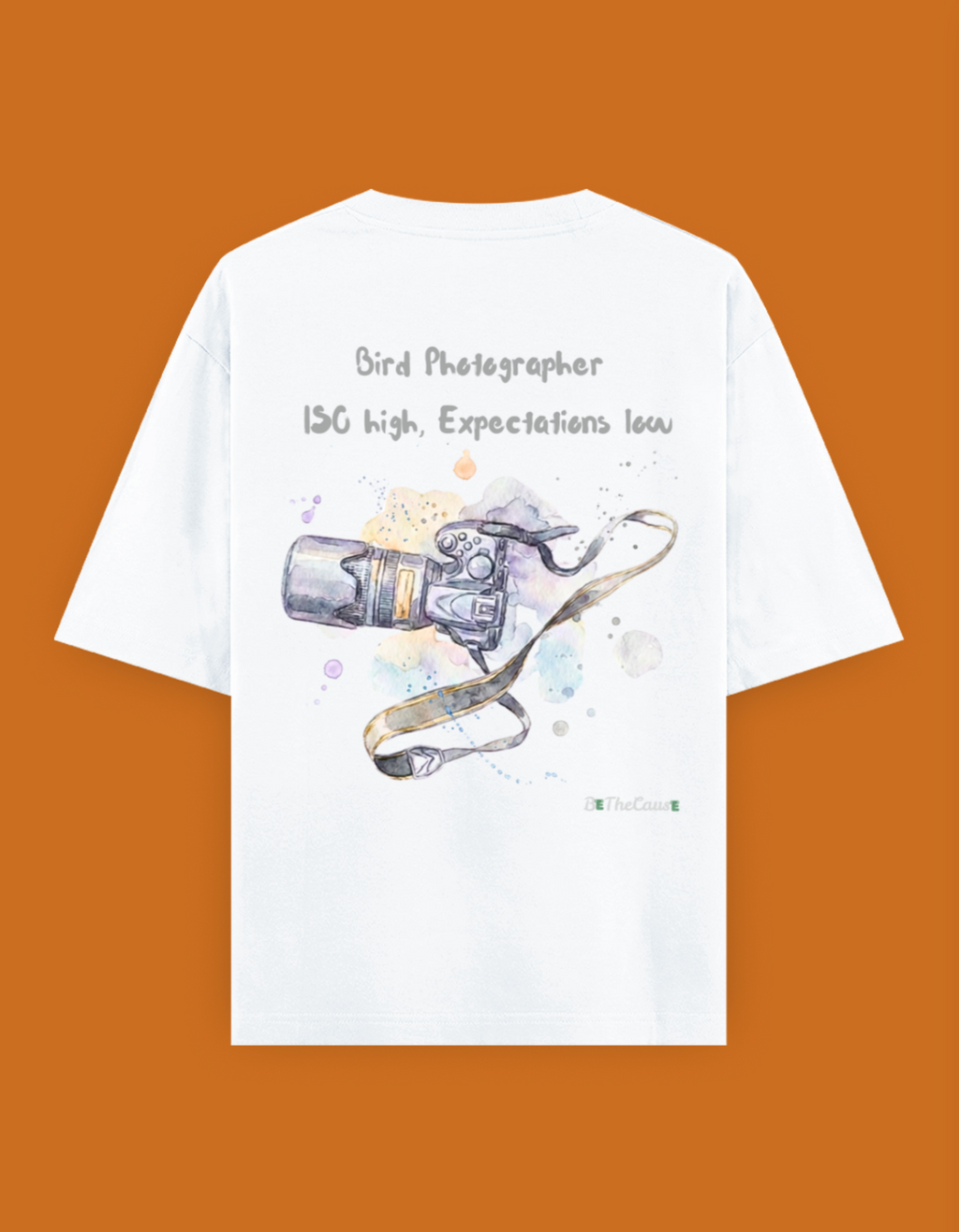 Shop a playful unisex oversized bird photographer t-shirt inspired by birding trips in the Western Ghats. Perfect for birders, wildlife photographers, and nature lovers.
