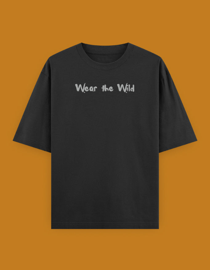 Shop a playful unisex oversized bird photographer t-shirt inspired by birding trips in the Western Ghats. Perfect for birders, wildlife photographers, and nature lovers.